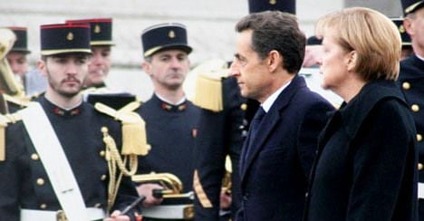 Sarkozy and Merkel demand tough new pact