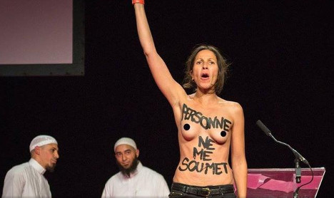Femen activists dragged off stage at Islam event