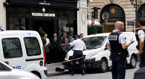 French police hold ten after raids on luxury Paris stores