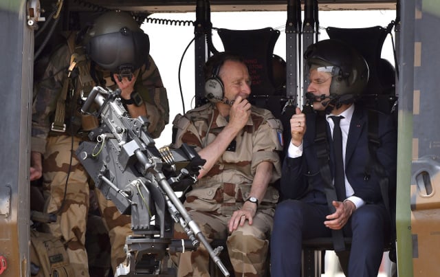 Macron visits French air base hoping to smooth over crisis with military