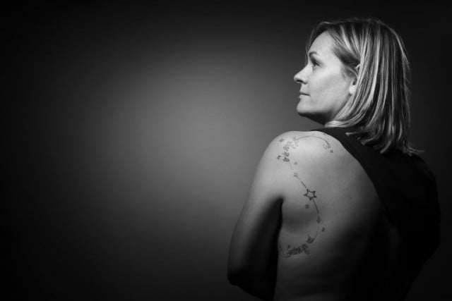 Fanny, who lost her partner Olivier at the Bataclan concert hall on November 13, 2015, shows her tattoo - the words 