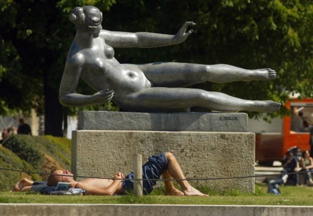 Can people go topless in French towns in the summer?