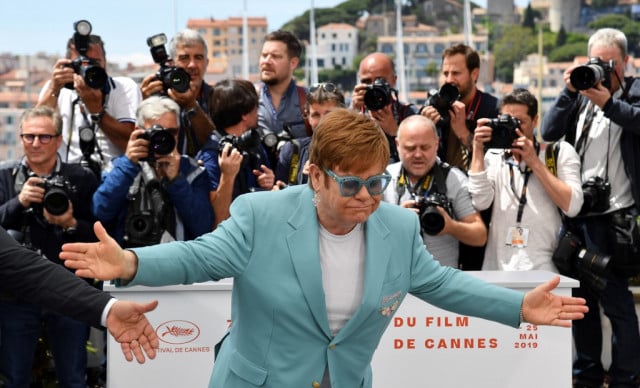 British singer-songwriter Elton John poses during a photocall for the film 
