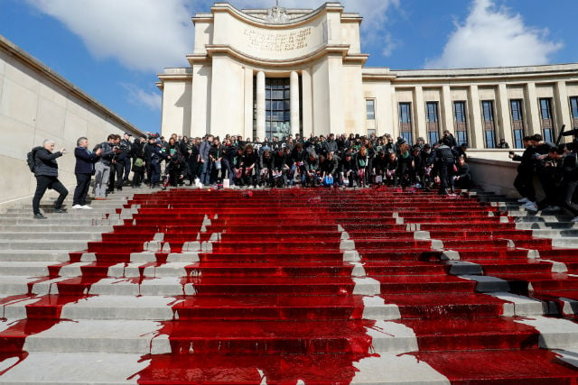 Green activists spill fake blood on Paris’s Trocadero