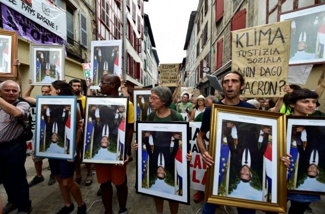 France anti-G7 activists march with ‘stolen’ Macron portraits