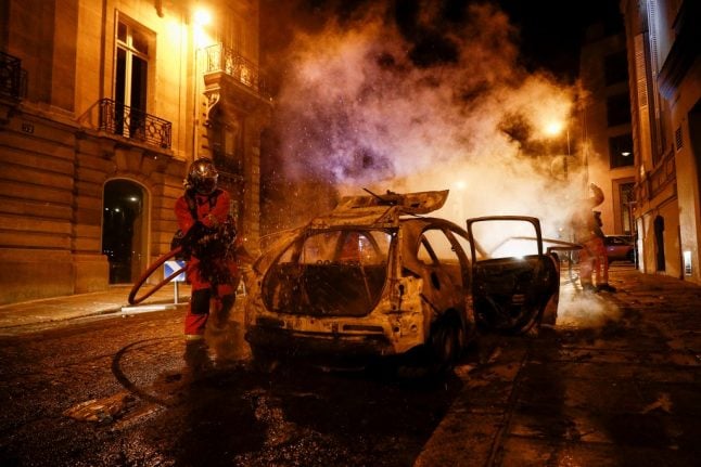 Police arrest 148 Paris-Saint-Germain fans as cars set ablaze after defeat