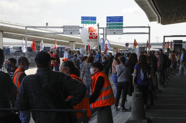 Striking workers block Paris airport terminal, flights delayed