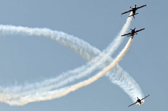The French Air Force aerobatics team performs in the air