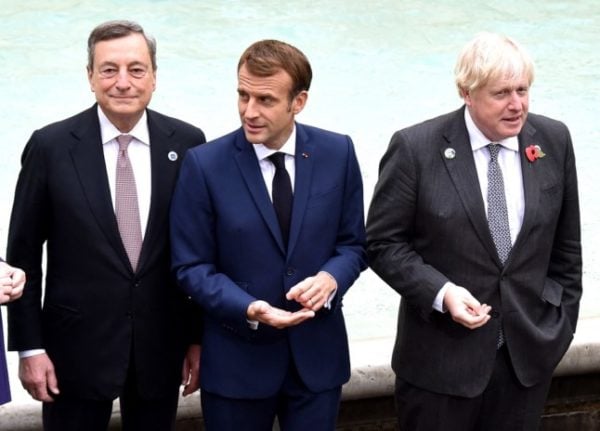 (From L) Italian Prime Minister Mario Draghi, French President Emmanuel Macron and British Prime Minister Boris Johnson at the Trevi fountain in central Rome