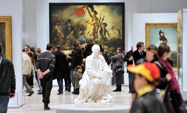 People visit the Louvre-Lens on the first day of its opening to the public, in 2012, while Delacroix's "Liberty Leading the People" was on loan at the museum.
