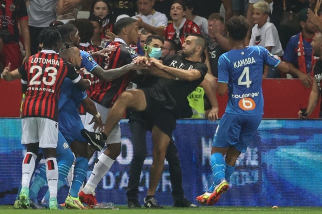 A Nice fan fights with Marseille players during the French Ligue 1 clash in August