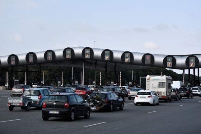 A queue of vehicles at a motorway toll area in Yvelines, near Paris, France