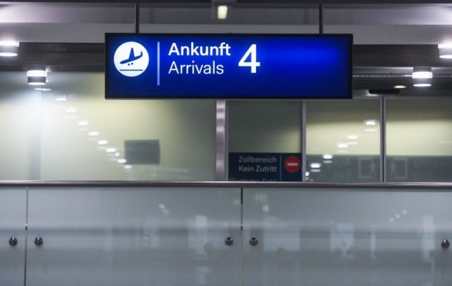 An airport arrivals sign.