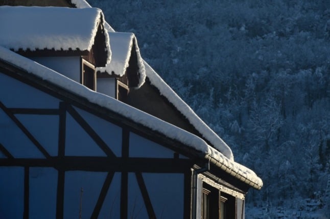 Snow covers a house in eastern France. The government is set to make it harder for people to sell energy inefficient housing from September 2022. 