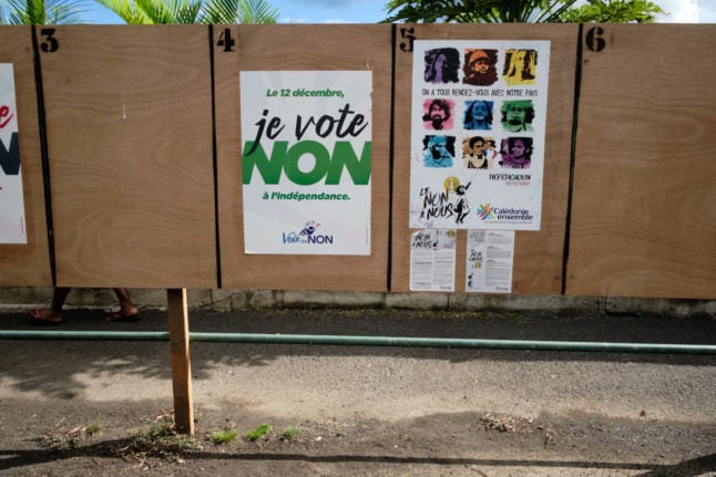 Posters can be seen on electoral boards near a polling station ahead of the referendum on independence from France in Noumea, on the French South Pacific territory of New Caledonia.