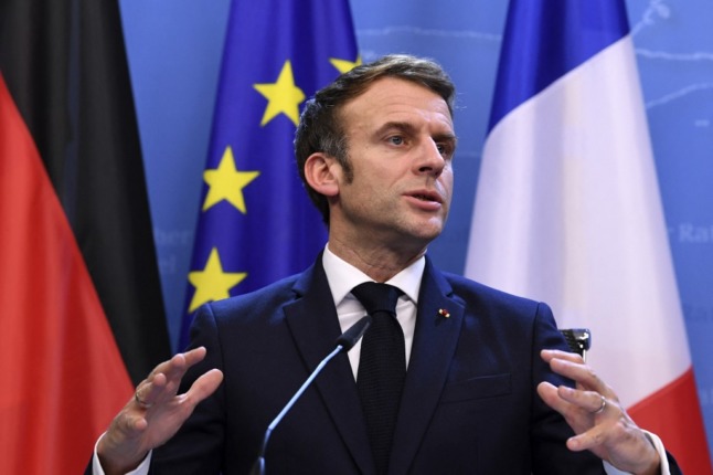 French President Emmanuel Macron addresses a press conference at an EU summit. 