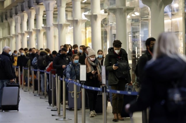 Passengers queue to board the Eurostar in the hours before new travel restrictions came into force.