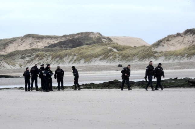 Police patrol a beach in northern France.