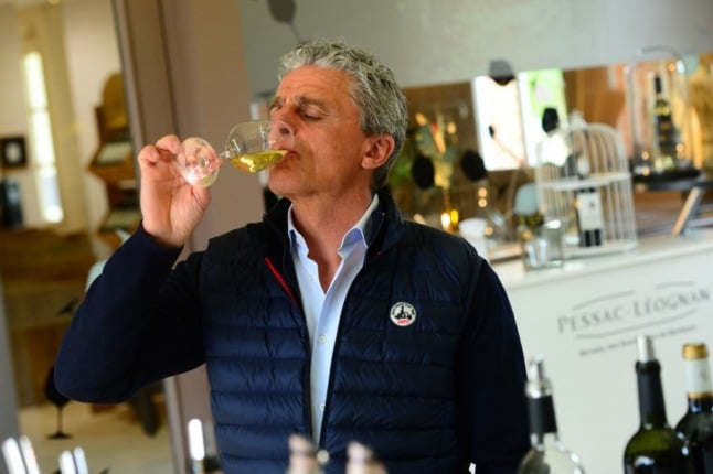 French owner of Chateau de Rouillac wine estate Laurent Cisneros tastes a wine