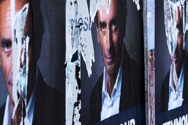 A torn poster of the French far-right media pundit and presidential hopeful, Eric Zemmour in Paris. 