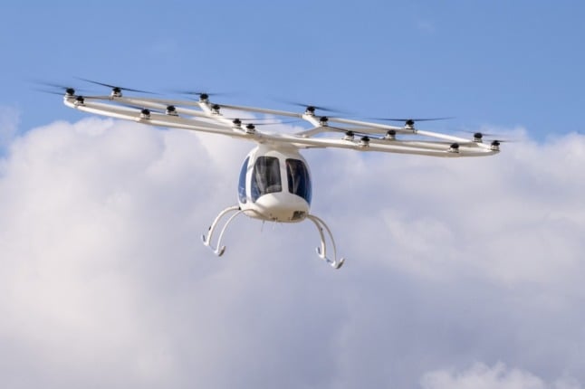 A VoloCopter prototype flies through the sky. 